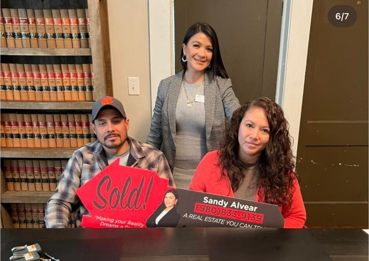 Clients with sold sign at home — Gastonia NC Alvear Group